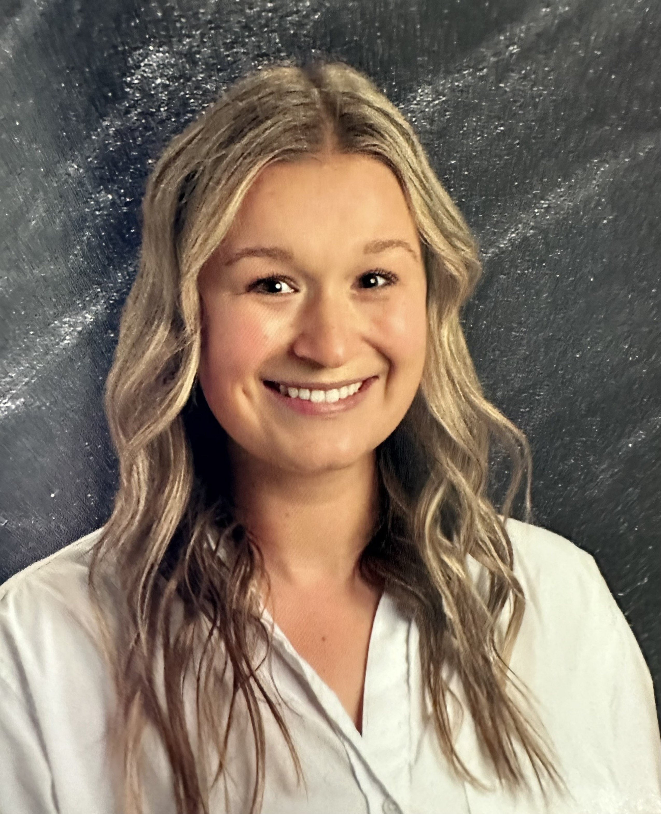 Headshot of McKenna smiling