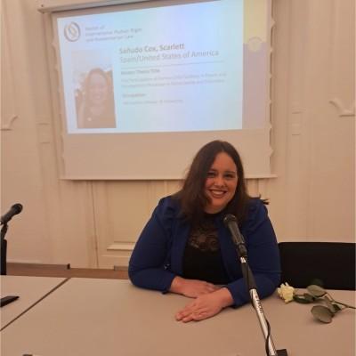 Portrait of Scarlett smiling during a presentation